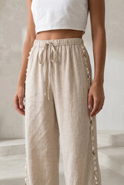 Pantalon large beige à coquillages | Lounelle Paris