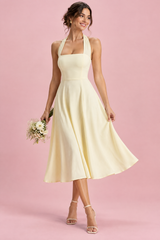 Pale yellow skater midi dress with a square neckline