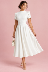 White midi dress with round neck and puff sleeves